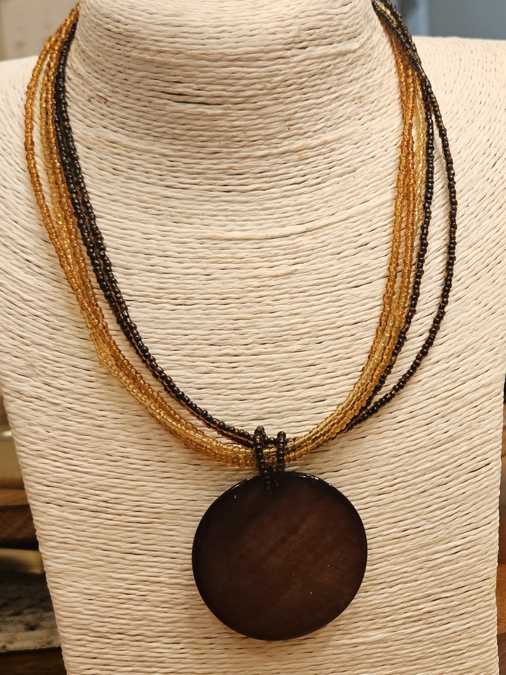 Claire's Amber and Black EARTHTONE Beaded Necklace with Brown Disc Pendant